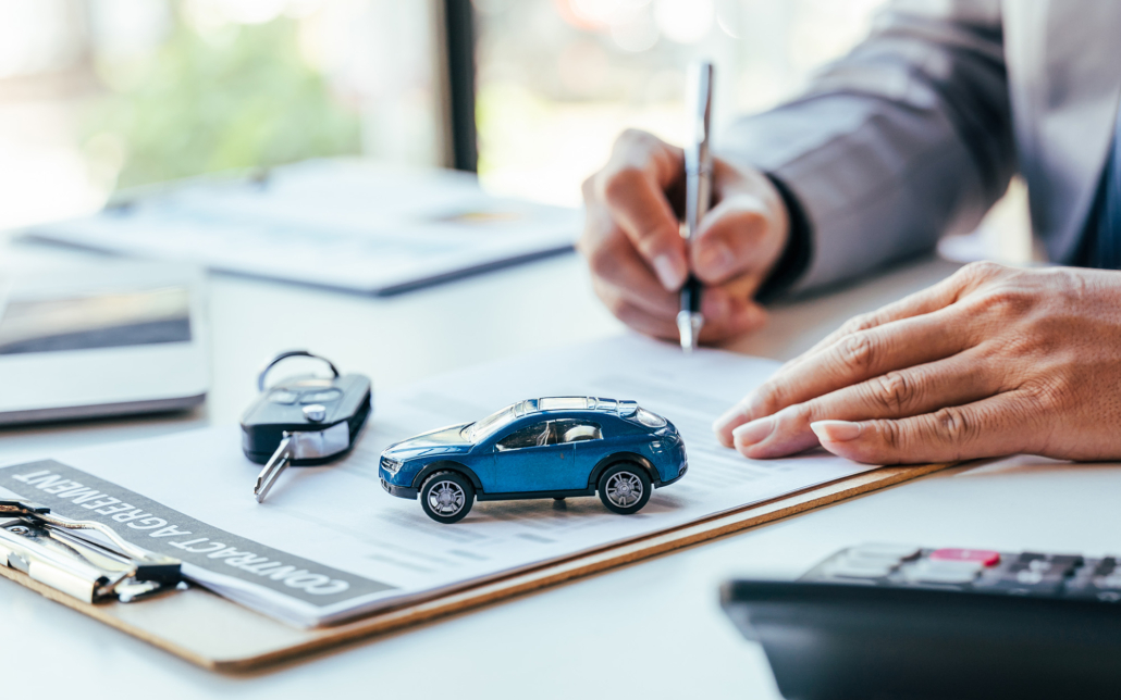 Man Signing Car Insurance Document Or Lease Paper. Writing Signature On Contract Or Agreement
